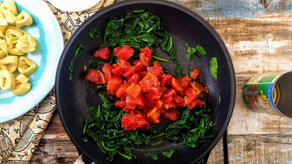 Sautéed spinach with Italian tomatoes